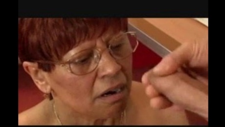 Granny in Glasses Satisfies a Cock