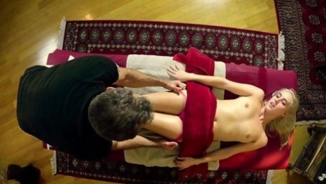 Sexy blonde lets hot masseur fool around with her ripe pussy